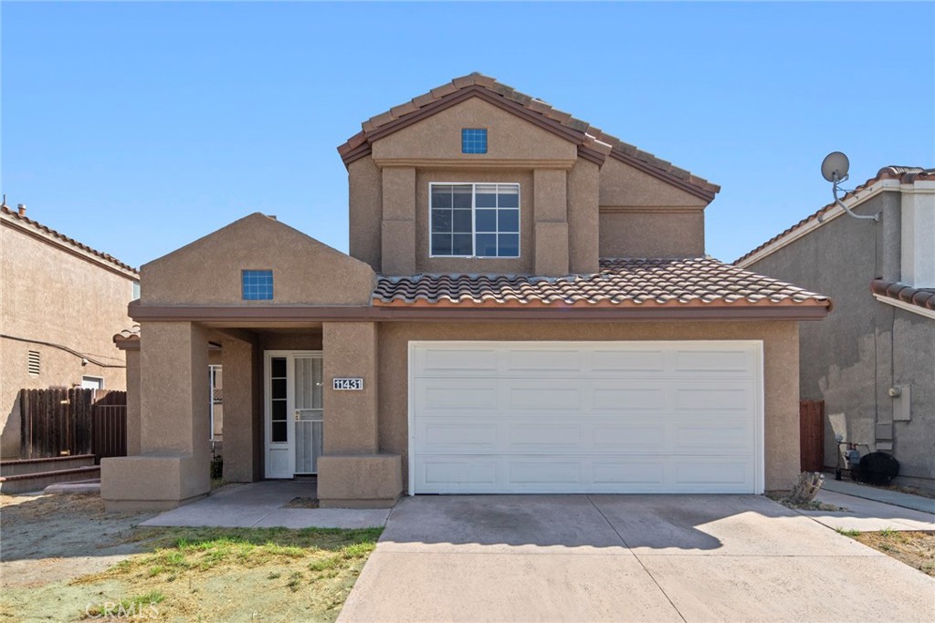 This two-story home is located in the Southridge neighborhood, close to schools and the Southridge Shopping Center. The home features an open floor plan with 5 bedrooms and 3.5 bathrooms. Laminate flooring and tile in the bathrooms are featured throughout. The living area, with its cozy fireplace and cathedral ceilings, is the perfect place to relax on cooler days. The newly renovated kitchen, with granite countertops, quality cabinets and a breakfast nook, opens to the family area and backyard, making it ideal for family gatherings and entertaining guests. Downstairs, there's a bedroom with its own full bathroom, as well as a half-bathroom for guests. Upstairs, the master bathroom has been completely renovated with double vanities, high-quality cabinetry, and a walk-in shower. Two spacious secondary bedrooms connect to a newly renovated bathroom with a shower. Just replaced the water heater. This home is perfect for a large family or multi-generational living. The roof is newer. The backyard is surrounded by concrete slabs and has direct access to the double garage. The home is close to schools, shopping, and parks, and offers easy access to the 60, 15, and 10 freeways. Don't miss this home!