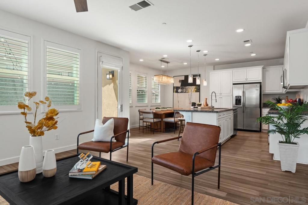 Welcome to 1767 Gentle Current Way, a beautifully maintained corner-lot home that blends modern style with everyday comfort. Built in 2016, this spacious residence offers an open layout designed for both relaxation and entertaining. At the heart of the home, the chef-inspired kitchen features a large center island, upgraded stainless steel appliances, and stylish light fixtures—perfect for gatherings with family and friends. The living spaces are enhanced by upgraded manufactured wood flooring, a modern accent wall, and custom wooden window blinds that add warmth and elegance throughout. Upstairs, a dedicated laundry room provides everyday convenience, while the large two-car garage with ceiling storage offers plenty of functionality. Step outside to an upgraded pavered back patio with ample seating along the garden wall, complemented by low-maintenance turf side yards—ideal for pets or play. With a low HOA of only $125, residents enjoy access to community amenities including grilling stations, a bocce court, and playgrounds. Ideally located just minutes from the beach, shopping, military bases, and major freeways, this property offers both accessibility and lifestyle. Whether you’re looking for your primary home or a strong rental investment, 1767 Gentle Current Way is a South Bay gem you won’t want to miss.