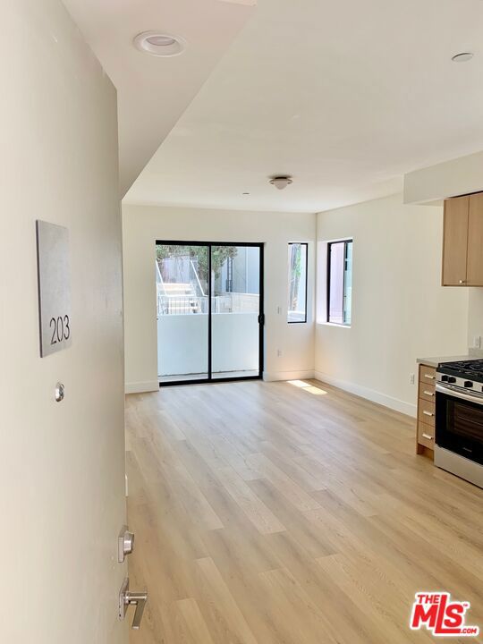 Discover elevated urban living in Westwood's newest modern apartment community. Perfectly tailored for professionals, students, and families, this brand-new construction 16 unit complex blends modern style with comfort and functionality. Be the first resident! Apartment 203 is rear-facing and is one of the two affordable only units. It features a 2 bedroom/2 bathroom open concept layout and is equipped with new stainless steel appliances, in-unit laundry, and central air and heat. Perhaps its most alluring quality, however, is the early morning light the rises over the panoramic city views - a wonderful setting to wake up to. Enjoy the ease of secure underground parking and working remotely from the rooftop deck. 1822 Overland is centrally located to major employment, freeways, and points of interest alike. Residents will enjoy the short 1.5 mile or less proximity to the UCLA campus, Century City Mall, the 405 freeway, and the upcoming Metro Purple Line extension stops at Wilshire/Gayley and Constellation/Avenue of the Stars. Don't miss this opportunity your new luxury lifestyle awaits!