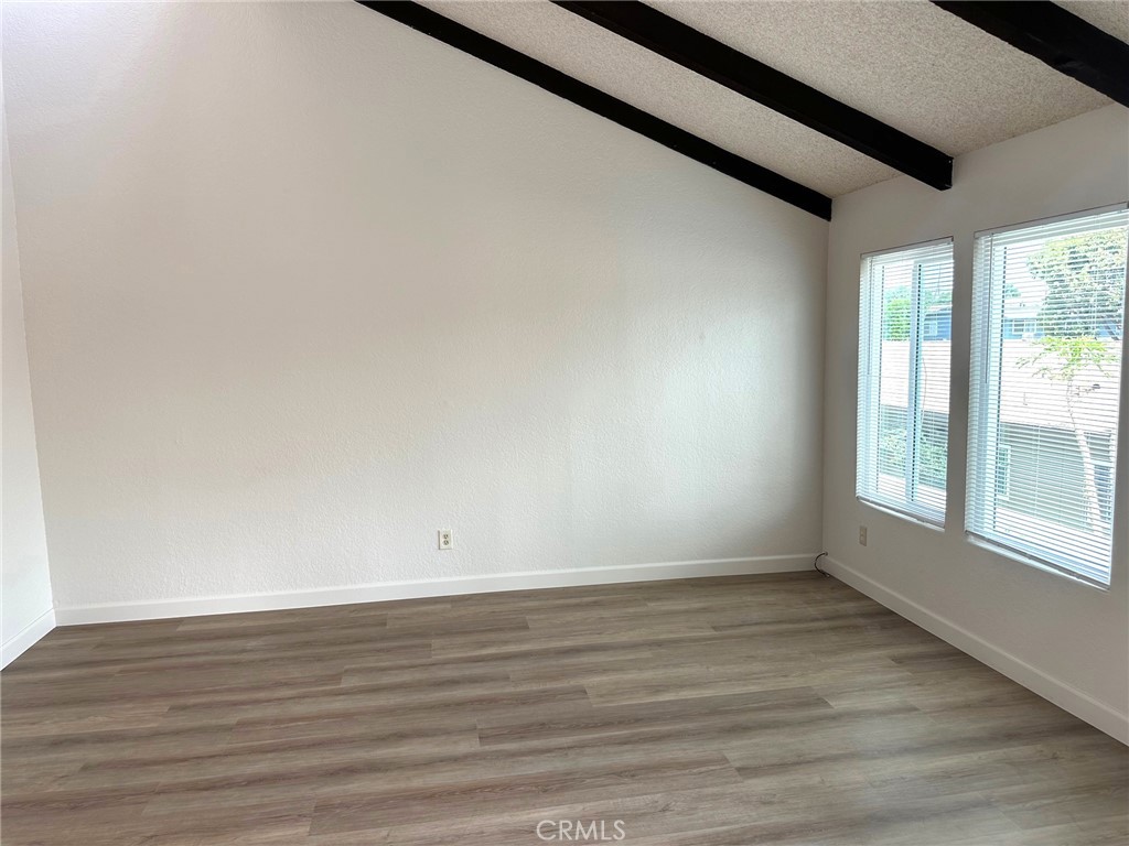 Welcome home to this spacious 2 bedroom, 2 bathroom residence offering approx. 1,100 sq. ft. of comfortable living space. One of our favorite property features is the peaked ceilings with skylights providing abundant natural light. The unit has just been painted and new LVP flooring installed throughout. The kitchen is open to the family room and has a brand new stainless steel gas range. Both bedrooms are generously sized, complemented by two full bathrooms for added convenience. Brand new vinyl windows throughout the unit. Additional amenities include an on-site laundry room, one-car garage, and water service included. Located in the desirable City of Orange, this home combines comfort and convenience. 1-year lease and one month’s deposit required. Qualifying income and credit are a must.