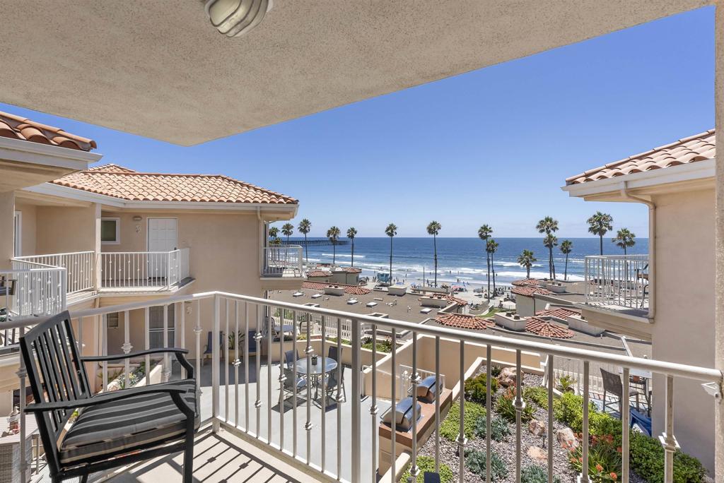 Start your mornings with blue ocean views and end your days with unforgettable sunsets over the Pacific. Perfectly positioned just north of the iconic Oceanside Pier, this stunning beach condo offers sweeping white-water views and effortless close by beach access—your personal front-row seat to coastal living. Step inside to an upgraded and move-in ready home where the Pacific Ocean is your backdrop. Catch ocean views from the open-concept kitchen and living room, or relax on your private balcony as the sun dips into the horizon. The primary bathroom has been tastefully updated with a large walk-in shower, adding to the refined coastal aesthetic. This two-bedroom, two-bath retreat is located in an intimate 15-unit gated community and features central A/C, in-unit laundry, two secure garage parking spaces, storage locker, and community bicycle storage room. Whether you're strolling to the beach, dining at nearby restaurants, sipping a coffee at a local café, or browsing boutiques and breweries, everything you love about Oceanside is just steps away. Community amenities include a shared BBQ and dining area perfect for summer evenings. Ideal as your primary residence or your personal getaway, this rare offering invites you to live the dream lifestyle—where every day feels like a vacation.
