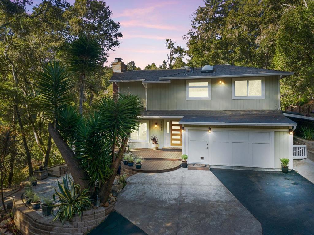 Tucked into Aptos hills only one mile from Cabrillo College. Two beautiful forest homes nestled into the hillside creates a welcoming and peaceful space. With show stopping views from every window, each room has been thoughtfully updated & renovated: all new flooring, welcoming kitchen with large island, quarts counters, farmhouse sink, Wolf range, & double ovens make a great space for living and entertaining. Beautiful master suite w/ its own fireplace, forest views, spa-like bath, and adjoining office. Two additional bedrooms share quartz and tiled bathroom with double sinks & a shower/tub and a separate laundry room. Additional main-level suite with its own private entrance. The detached ADU mirrors the main house design with a full kitchen, bath, bedroom, and cantilevered deck, with treehouse like views. This is perfect for guests, extended family, or rental income. Ask agent about prior 3-year rental income history. Ideal for buyers seeking peace, artistic inspiration, or a quiet base for hybrid work lifethis isnt just a home, its a retreat from the world.