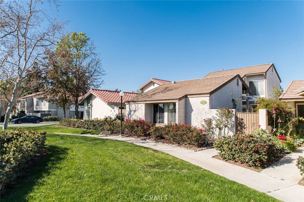 Enchanted DREAM home! Truly one of a kind! 2 car garage + 1 gated parking space. This Single Family Residence has a fabulous floor plan including two bedrooms downstairs w/ a full bath, and a separate master suite upstairs full of upgrades. Bright home featuring high ceiling w arched opening into a dream kitchen equipped with commercial stainless steel appliances w/ extra built-ins: custom range hood w/food warmer, plumbed coffee brewing station, wine cooler, food mixer counter. Countless designer upgrades with attention to details at every turn! Floor to ceiling river rock fireplace with remote starter, crown molding, tiled bathrooms, automatic humidity controlled ceiling fan, self-cleaning toilet, recessed lights w dimmers, energy efficiency features through out and two attic fans with on/off switches and thermostats... Front entryway with custom wrought iron gate opens into a paradise of courtyard with well designed garden, river rock planters with rain barrel dripping system. Extended cover patio from two sets of French doors create the well sought after indoor/outdoor feel which extends your living area. Extra RV size parking space behind custom gate, in addition to attached garage with direct access to kitchen. Front downstairs bedrooms look out to community greenbelt park. Community amenities include two swimming pools, a clubhouse, and tennis courts! Oak Creek Golf Course just across street. Close to shopping, schools, parks, hospitals & freeway access.