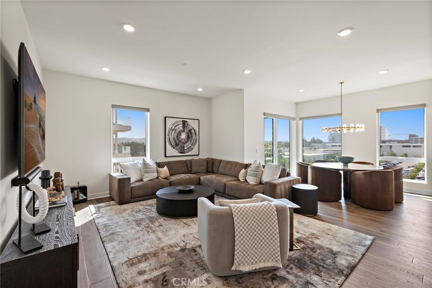 Exquisite Executive Corner Residence | Fully Furnished | Exclusive Lexington Community. Welcome to an extraordinary brand-new, never-lived-in, fully furnished, luxury home showcasing sophisticated design, bespoke furnishings, and breathtaking panoramic views. Nestled in a premier private corner location within the prestigious Lexington community, this executive three-bedroom residence is fully furnished with designer-curated, top-quality pieces from floor to ceiling.  The striking great room serves as the centerpiece of the home, anchored by a chef-inspired kitchen with an oversized island with seating for four, Monogram professional-grade appliances, a built-in refrigerator, digital touchscreen oven and microwave, and a high-performance range with stainless steel griddle. The adjacent living area invites relaxation with a Restoration Hardware sectional and an immersive theater-quality entertainment system, while the elegant dining area—with its round Onyx inlay table for six—captures breathtaking sunset and city-light views. Two expansive private suites each feature custom-built walk-in closets, and a versatile third room can serve as a bedroom, den, or executive office. Designer lighting, architectural details, and luxurious finishes throughout create an atmosphere of warmth, sophistication, and modern comfort. Additional luxury features include Hunter Douglas electronic designer shades throughout, a whole-home integrated audio system with concealed ceiling speakers, four Samsung TVs paired with Sonos sound bars and centralized smart control, and custom cabinetry with built-in storage solutions.Residents of the Lexington community enjoy access to exclusive amenities, including a modern fitness center, clubhouse, and beautifully landscaped outdoor cooking and lounging areas.  Along with full privileges to the resort-style offerings at Central Park West, which feature two sparkling pools and spa, an 8,000-square-foot clubhouse, state-of-the-art gym, yoga studio, pickle-ball and basketball courts, outdoor work-spaces, and gated dog parks. The home’s prime Irvine location provides easy access to the University of California, Irvine, and major transportation corridors including the 405, 55, and 73 freeways. Just minutes away are the premier destinations of South Coast Plaza, Fashion Island, and the Irvine Spectrum, along with the beaches of Newport, Corona del Mar, and Crystal Cove and fine dining just a short walk away.