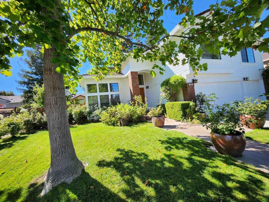 * Gorgeous home in Central Pleasanton * This home is chock full of special details! * Tons of natural light from windows, skylights and 3 custom sun tunnels * Custom marble flooring throughout the main floor and in one bedroom and both bathrooms upstairs * Expansive granite and marble kitchen with huge island, extra cabinetry, modern appliances, under cabinet-lighting, glass tile accents, Kohler fixtures * Huge Primary bedroom with double-doors, a retreat, cathedral ceiling and dual fireplace connecting it to its stunning bathroom * Cathedral 20 foot ceilings in living and dining rooms * Separate huge formal dining room seats 12, with 2 huge beautiful custom stained glass windows * Huge custom stained glass window in living room * Custom, modern fixtures and mirrors in all baths.  Tulip sinks in all bathrooms.  Picture frame mirror. * Gorgeous granite counters throughout * Exclusive custom lighting throughout home including crystal and tiffany chandeliers and fixtures * Large custom stained-glass transoms and beveled glass doors * Ceiling fans with lights throughout * Office/Den has double-doors and could also be used as a 4th bedroom. Featuring stained glass window and built in cabinetry, plus sun tunnel for natural light. * Park like yards for 100% relaxation.  Awning w lights