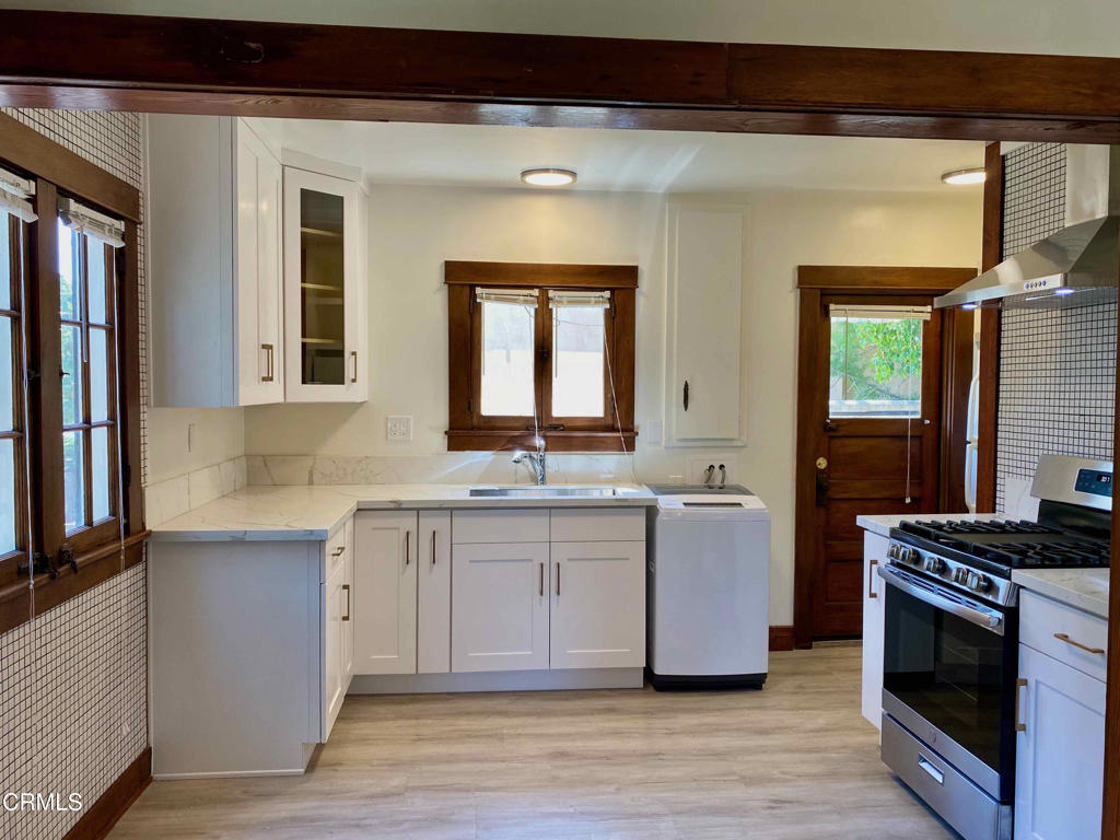 7 single level, free standing cottages on a well-landscaped 15,000 sqft lot; An oasis in the middle of city life; walking distance to shopping, and restaurants; newer floors; updated kitchen with farm sink and quartz counter, updated bathroom with subway tiles, all updates matching with original character; one assigned parking space; washer inside unit; stove and refrigerator included, spacious front yard and private, fenced side yard. Landlord pays for water & trash, move-in condition!