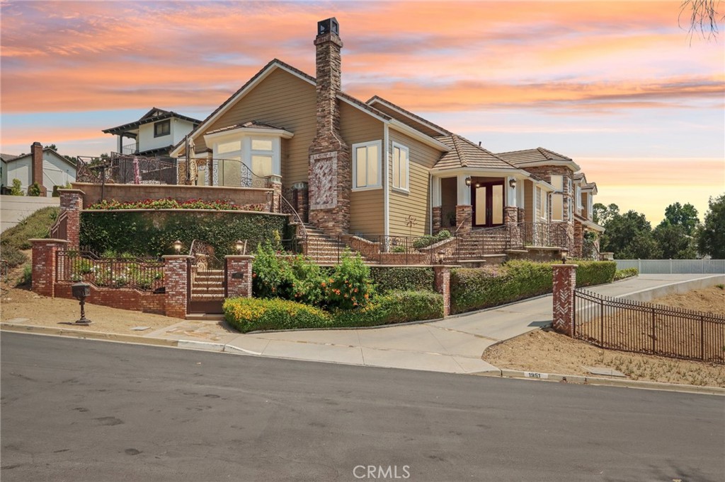 Rare 2.12-Acre Equestrian Estate on Walnut Creek Trail in San Dimas. Exceptional opportunity to own one of San Dimas’ premier equestrian properties! Situated on a private 2.12-acre lot with direct access to the Lyman Staging Area & trailhead. This custom 4 bed, 3.5 bath home (plus a 3/4
bath in the barn) offers the perfect blend of luxury living, functional space & horse-friendly amenities. Inside, enjoy a spacious living room with
large picture windows that frame breathtaking views. Adjacent is a generous office with a walk-in closet—easily convertible into a fifth
bedroom. A step up leads to the elegant formal dining room, adorned with custom woodwork & a full-wall hutch ideal for china & linen storage.
The heart of the home is a dream kitchen outfitted with high-end Thermador appliances, including a stove with a warming drawer, double
ovens, & oversized built-in refrigerator. Rich cherry wood cabinetry, granite counter tops, a walk-in pantry, & an oversized island with bar seating make it the ultimate gathering space. The adjoining great room with 22’ ceiling, fireplace & a sun-drenched breakfast nook creates a warm, open atmosphere perfect for everyday living and entertaining. Upstairs offers more space to unwind, featuring a custom bar, game room, additional bedroom, and full bath. Down the hall past the dining room & powder room, is the private primary suite that boasts a fireplace, sliding doors to a secluded patio, a spa-like bathroom with oversized shower, Jacuzzi tub, and an expansive walk-in closet. Two additional bedrooms and
a hallway bath complete the main sleeping quarters. Step outside and down the slope to a thoughtfully designed 6-stall barn, complete with a
large 16x24 stall currently used as a workshop, stall mats, fly system, ventilation, feeders, tack room, hay storage, wash rack, & a bathroom
with washer/dryer hookups. The riding arena is spacious with room to expand, multiple shady turnouts offer the horses comfort & a variable-
speed hot walker is located at the edge of the horse area. All landscaping is on a drip system for year-round beauty. Additional highlights include
custom iron & brick fencing around the entire estate, plentiful trailer parking & a dump station. This is a prime location just minutes from the 210/57/10 freeways, Ontario Airport, Cal Poly Pomona & the Claremont Colleges. This rare equestrian sanctuary is the perfect blend of rural charm & urban accessibility—schedule your private
tour today!
