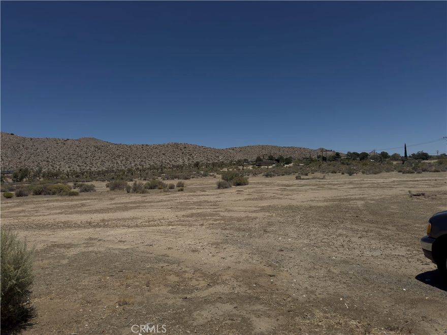 ***EXPANSIVE LOT TUCKED BETWEEN TWO MAJOR PAVED ROADS*** The largest and lowest priced residential lot just a quarter mile north of the Hwy 62 in downtown Yucca Valley. Steps away from Little League park, Yucca Valley BMX Park and the High Desert Nature Museum. Perfect land for a builder or to hold for future use. 29 Palms Highway is the major road that connects Morongo Valley to the towns of Joshua Tree, 29 Palms, Landers and Lucerne Valley. The bustling town of Yucca Valley has designated this area R-L-1, potential for up to six homes in a subdivision. Buyers, Buyers Agents and interested parties should independently check their own usage plans with the local authorities. No guaranties or warranties implied.