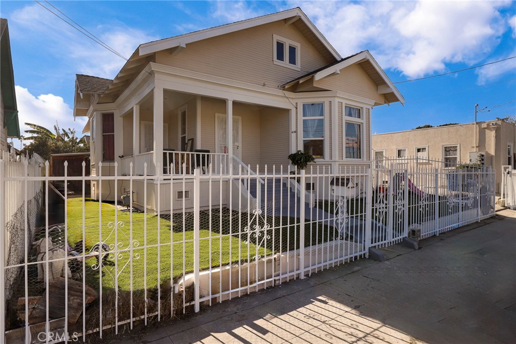 Exceptional Multi-Unit Compound on Double Corner Lot!! Introducing a rare opportunity to acquire a meticulously maintained multi-unit property situated on a prime double corner lot. This unique compound features three distinct buildings, offering a blend of spacious living and investment potential, making it ideal for both long-term rentals and owner-occupancy. Main Residence: Four-Bedroom House!! At the heart of the property lies a separately fenced four-bedroom house, characterized by its impressive high ceilings and exceptionally large rooms. This home boasts generous closet space, ensuring ample storage for all your needs. The expansive yard provides a private outdoor retreat, perfect for family gatherings or serene relaxation. Detached Four-Bedroom, Two-Bathroom Home!! Adjacent to the main house is a detached four-bedroom, two-bathroom residence that has been remodeled to meet modern standards. With a newer roof, updated kitchen, and contemporary bathrooms, this home offers a fresh and inviting atmosphere. Spanish Style Duplex with Two-Bedroom Apartments!! Completing this remarkable compound is a charming Spanish duplex featuring two well-maintained two-bedroom apartments. Each unit is occupied by long-term tenants, ensuring a stable rental income stream for the new owner. The classic architecture and thoughtful design of these apartments contribute to the property’s overall appeal, making it an attractive option for renters. This property is legally classified as a five-plex, having converted one duplex into a single-family dwelling, further enhancing its investment potential. With a combination of long-term tenants and owner-occupancy opportunities, this compound presents a unique chance to capitalize on the booming rental market while enjoying the benefits of homeownership. Don’t miss this exceptional opportunity to invest in a well-maintained multi-unit property that offers both immediate rental income and the possibility for personal use. With its prime location, spacious units, and attractive features, this compound is poised to sell quickly. Whether you are an astute investor or seeking a beautiful residence with additional rental potential, this property is sure to exceed your expectations.