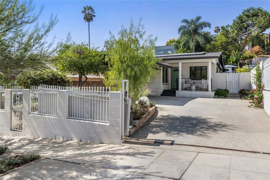 Tucked away on a quiet residential street, this beautifully updated three-bedroom, two-bath home blends mid-century character with modern comfort in one of Highland Park’s most sought-after pockets. Walkable to an abundance of restaurants, nightlife, and shopping along York Blvd, it offers the ideal balance of vibrant city living and peaceful retreat.



Step inside to an open-concept layout featuring a remodeled kitchen with quartz counters, high-end appliances, and sleek concrete floors that flow seamlessly into the dining area. Sliding glass doors open to a shaded patio with a retractable awning—perfect for indoor-outdoor entertaining. Adjacent to the dining area, the living room centers around a gas fireplace, with brand-new floors running throughout the home for a cohesive, contemporary feel.



Tucked at the back of the house, the primary bedroom offers a wall of built-in closets and an ensuite bathroom, along with direct access to the backyard. Two additional bedrooms share a stylish hallway bathroom with double sinks, providing comfort and functionality for family or guests.



Outside, the beautifully landscaped, multi-level backyard is a peaceful sanctuary with thoughtful terracing and hillside views. Enjoy multiple zones for dining, relaxing, and gardening—all amid fruit trees, drought-tolerant plants, and a lush lawn. A detached, climate-controlled office with skylights and Gigabit fiber internet offers an ideal work-from-home or creative space, while a separate tool shed at the upper terrace provides extra storage or flexible use. Pet owners and families with young children will enjoy the security of attractive ironwork gates which can remain open and out of the way, or control access to the back and front yards in multiple configurations for privacy, security and seclusion.



In addition, sustainability meets convenience with an owned Tesla solar system, Powerwall battery for electricity storage and backup, and electric car charger, paired with a two-car carport at the front of the home. 



Stylish, sustainable, and perfectly located—this Highland Park gem captures the very best of Eastside living.
