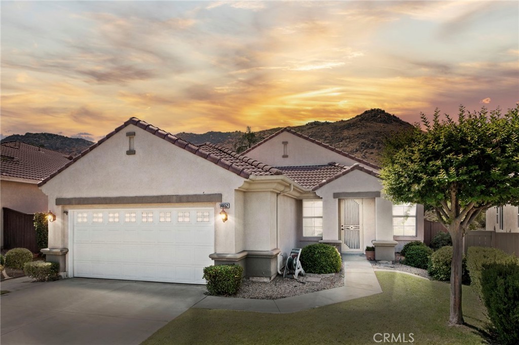 Outstanding gated senior community single story in the highly desirable Mountain View community. This beautiful 3 bedroom, 2 bathroom home offers an open floor plan that just received a fresh coat of paint, spacious eat-in kitchen with granite counters that opens to the family room which offers a cozy fireplace, a large owner's suite that offers a walk-in closet & a large bathroom with dual vanities and a separate tub and shower, interior laundry room with ample storage, 2 secondary bedrooms (one currently used as an office with built-in desk). The backyard offers an inviting patio with an alumi-wood patio cover and low maintenance yard. The AC unit was replaced a couple years ago and works wonderfully. The community offers a beautiful swimming pool and is completed gated.