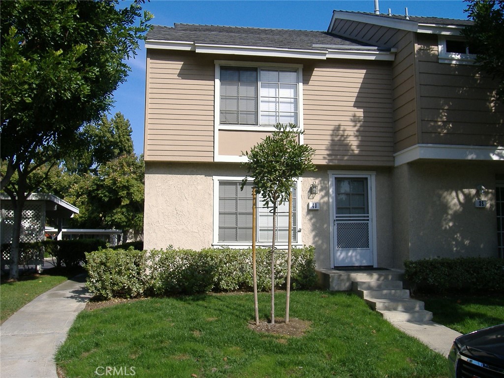 Charming light & bright 2 bedroom, 2.5 bath two story townhome. End unit with only one shared wall - no one above or below. Large living room and dining room with tile floors, remodeled kitchen, and both bedrooms upstairs. 2 seperate bathrooms upstairs - each one includes a shower. Private sun-filled patio with extra storage closet. Two assigned carport spaces are directly behind the private patio for easy access. Award winning neighborhood schools are all within walking distance. Timber Run Park is directly across the street and includes a full size basketball court, handball courts, 2 tennis courts, a tether ball court, and the Timber Run adult pool/spa. Walking distance to Blue Lake Swim Club Park which includes a family friendly pool & spa. Fantastic location. Close to shopping, parks, pools and John Wayne Airport. Enjoy all of Woodbridge's many wonderful amenities.