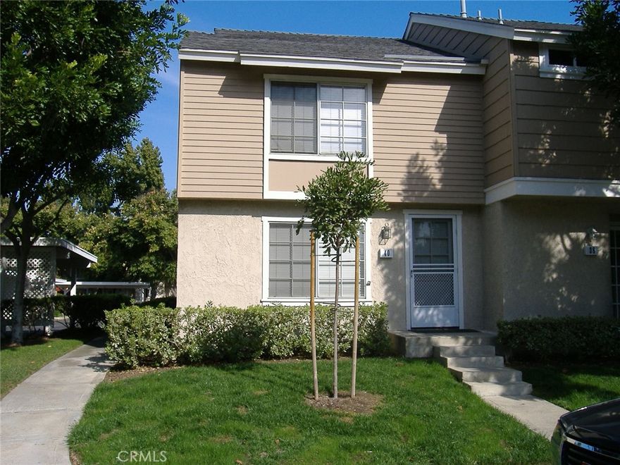 Charming light & bright 2 bedroom, 2.5 bath two story townhome. End unit with only one shared wall - no one above or below. Large living room and dining room with tile floors, remodeled kitchen, and both bedrooms upstairs. 2 seperate bathrooms upstairs - each one includes a shower. Private sun-filled patio with extra storage closet. Two assigned carport spaces are directly behind the private patio for easy access. Award winning neighborhood schools are all within walking distance. Timber Run Park is directly across the street and includes a full size basketball court, handball courts, 2 tennis courts, a tether ball court, and the Timber Run adult pool/spa.  Walking distance to Blue Lake Swim Club Park which includes a family friendly pool & spa. Fantastic location.  Close to shopping, parks, pools and John Wayne Airport.  Enjoy all of Woodbridge's many wonderful amenities.