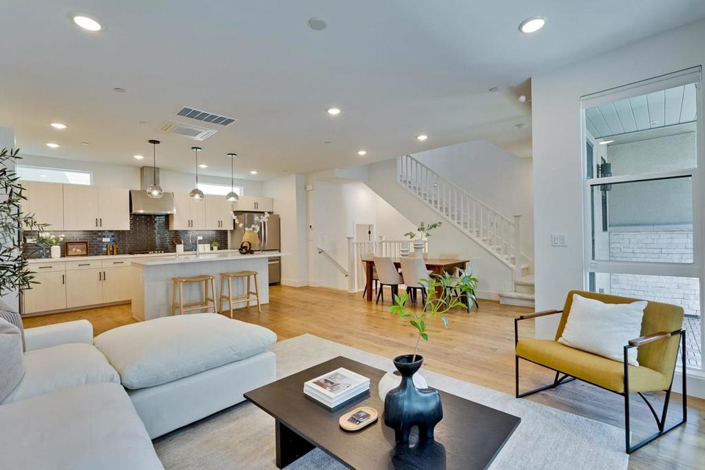 Beautiful 5-year-new Summerhill Homes in sought-after community. This spacious floor plan offers 3 bedrooms and 3.5 bathrooms, with abundant natural light throughout. The open main level features a chefs kitchen with large island, quartz counters, white cabinets, designer backsplash, stainless appliances, and ample storage. The primary suite includes dual vanities and a walk-in shower with bench, while the top floor adds a private bedroom, full bath, and rooftop terrace with linear fireplace. Upgrades include zoned HVAC, tankless water heater, and EV charger. Community amenities: basketball court, playground, outdoor gym, dog parks, garden planters, clubhouse & BBQs. Minutes to tech campuses, Caltrain, shopping, dining, and downtowns modern low-maintenance living in Silicon Valley!