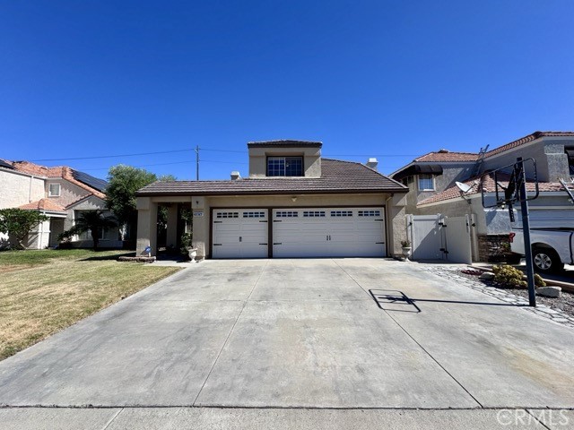 Welcome to this beautiful 5 bedroom, 3 bathroom two story home with a 3 car garage in the highly sought-after Menifee Lakes community! Now available for lease and move in ready, this spacious home features plank flooring, tile, and brand new carpeting throughout. As you enter, you're greeted by a bright living room with shuttered windows on your left. To your right is the formal dining room, a full bathroom, a bedroom, and a recently renovated kitchen that flows into the family room with a cozy fireplace. The kitchen offers off-white cabinets, granite countertops, a tile backsplash, stainless steel appliances, and a peninsula with extra seating. Upstairs, discover a loft with built-in cabinetry making it perfect for a home office, and four additional bedrooms. The primary suite is full of natural light, with a private oversized balcony, dual sinks, a generous soaking tub/shower combo, and a large walk in closet with built-ins. The backyard includes a covered patio, a large grassy area, a gazebo, and no rear neighbors, perfect for relaxing or entertaining. Living in Menifee Lakes means enjoying beautiful scenic lakes with walking trails, beach club, and fishing, along with neighborhood parks, a community clubhouse with pools and fitness amenities, and access to the Menifee Lakes Country Club featuring a 36 hole golf course. Conveniently located near shopping, dining, 215 freewat and schools, this home truly has it all. Schedule your showing today!