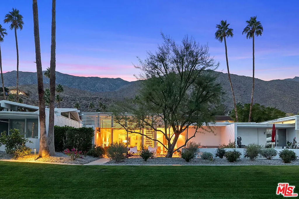 This unit is booked for Jan/Feb 2026. Kick back and relax in this calm, stylish space. Designed by William Krisel, the condo captures the spirit of the Sixties with breeze blocks, globe lights, and bright orange accents. 30 day + rentals only. Rare Mid-Century Modern Condo in Iconic Canyon View Estates, Palm Springs. Live in one of Palm Springs' most coveted mid-century modern communities! This stunning end-unit condo, located in the prestigious Canyon View Estates, offers the perfect blend of classic design, privacy, and panoramic desert views. Designed by renowned architect William Krisel, this rare unit is one of only eight with a distinctive level roof and prime end-unit location. Inside, you'll find bright, open living spaces filled with natural light, thanks to dramatic clerestory windows that stretch along the entire southern side especially highlighting the kitchen. The spacious living area flows seamlessly to a private back patio through large sliding glass doors, framing breathtaking views of the Andreas Hills. Original mid-century details have been lovingly preserved, including vintage tile work in both bathrooms and sleek built-in cabinetry throughout. Enjoy ample storage, clean architectural lines, and the timeless charm that defines Palm Springs style. Whether you're relaxing on the patio or entertaining in this one-of-a-kind space, you'll be surrounded by the beauty and history of true mid-century design. Highlights: New terrazzo tile floors throughout the unit and patios, End unit with enhanced privacy, Clerestory windows throughout the living room and kitchen, Floor-to-ceiling living room windows leading to the patio, Vintage mid-century details throughout, Stunning mountain views, Community pool and spa, Lush landscaping, Prime location in South Palm Springs. Don't miss this opportunity to rent a piece of Palm Springs architectural history! Rental rates: Off Season (June -Aug) - $3500 Shoulder Season (Sept, Oct, Nov, May) $4000 Peak Season (Dec, Jan, Feb, Mar, April) $4600 PLUS cleaning fee. Utilities included. Electricity included up to $350/mo. Overage to be paid by guest.