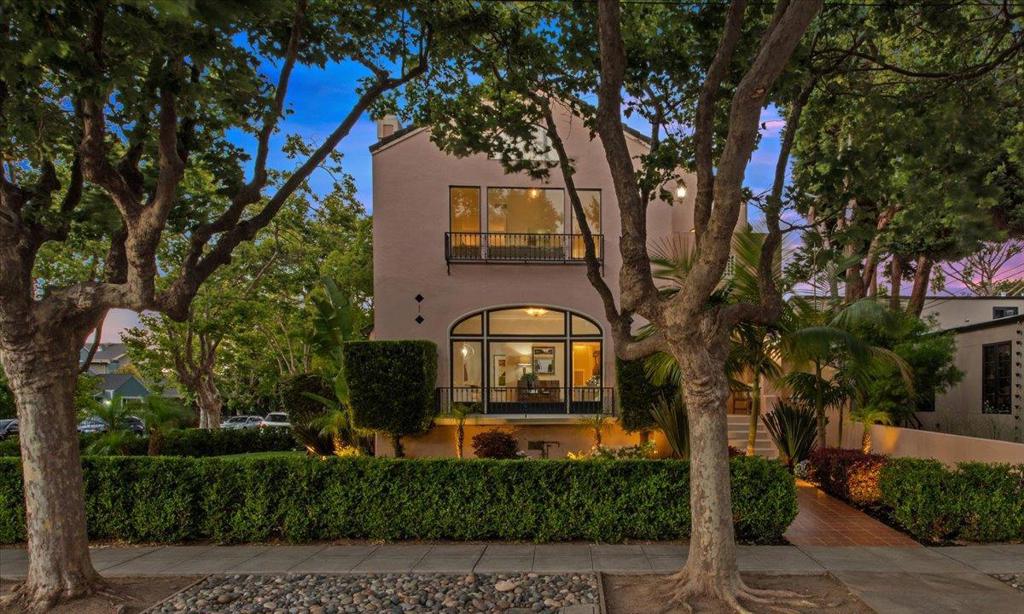 Welcome to this charming Spanish style home situated on a corner lot along a picturesque tree-lined street in the heart of Hayward Park. Framed by palm trees & lush lawn, the front porch leads to a central foyer that opens to the main home or the upper level - ideal for multi-generational, extended family, or guests. Generously sized & designed to live like two SFRs. The main residence offers arched windows, bright living rm with wood burning FP, formal dining rm & eat-in kitchen. All three bedrooms are on one level, including a primary suite with dual sinks & separate tub/shower; one secondary bedroom enjoys a private balcony. A large family rm off the kitchen features a FP, laundry area & slider to an expansive yard with a pool & built-in waterfalls, spa & an outdoor kitchen with BBQ, sink, fridge, TV & FP. The upper level offers a private entry, living rm with FP & balcony, dining rm, eat-in kitchen & laundry. Both bedrooms open to a shared balcony & the primary suite includes a FP, two closets & full bath - perfect for extended family, guests, or rental income. An attached two-car garage completes this home. Easy access to Downtown San Mateo, Central Park, Caltrain & Hillsdale Shopping Center, this home offers space & flexibility in a prime location.