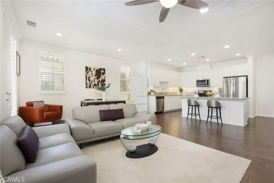 MODERN TOP-FLOOR SINGLE-STORY CONDO IN LA FLORESTA WITH RESORT-STYLE POOL & SPA! This top-floor, single-story condo with a charming Spanish-inspired traditional exterior features 2 bedrooms and 2 bathrooms, designed for comfort and modern convenience. Step into the open floorplan home featuring new engineered wood floors, crown molding, plantation shutters, high ceilings, and recessed lighting—all enhanced by abundant windows that fill the space with natural light. The kitchen is open to the living room, creating an ideal space for entertaining. Enjoy granite counters, bright white cabinets, stainless steel appliances, a stylish tiled backsplash, and an island with barstool seating and built-in storage. Built-in cabinets provide extra storage, and waterproof engineered wood flooring adds durability and style. Just off the living room is the extra-long patio, spanning the length of the family room, with sunset views of the Village at La Floresta shopping plaza. Convenience continues in the hallway with a side-by-side in-closet laundry featuring custom shelving for added organization, plus additional hallway cabinets and a coat closet for even more storage. Step into the peaceful bedrooms, both with waterproof laminate flooring and no shared side walls for quiet, restful nights. The primary suite boasts a bright corner location with windows on multiple sides, a walk-in closet with built-in shelving, dual sinks, a bidet toilet, and a glass-enclosed walk-in shower. The second bathroom also features waterproof tile flooring and a new toilet. Enjoy easy access to your home by stairs or elevator, leading to a detached, two-car garage. Life at La Floresta brings a true sense of community with access to a sparkling pool and spa, modern clubhouse, outdoor cooking and gathering spaces, a splash pad, fire pit lounge, and miles of scenic walking paths. Residents also love the unbeatable location—just a short stroll to The Village at La Floresta featuring Whole Foods, coffee shops, premier shopping and dining and near parks, top-rated Brea Olinda schools, and the Regional Carbon Canyon Park. Schedule your private tour today!