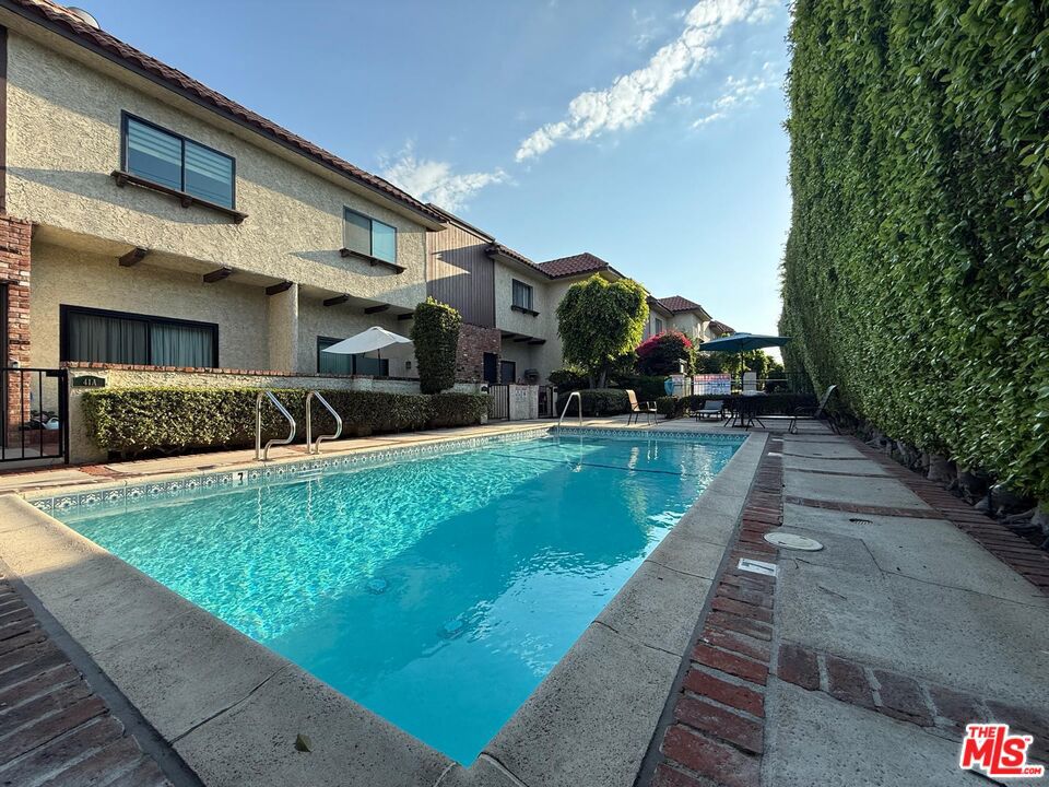 Spacious 3-bedroom, 2.5-bath townhouse for rent in a well-maintained gated community in Burbank. This bright and inviting end unit offers 1,577 sq ft of living space with high ceilings, laminate flooring, and an updated kitchen featuring granite countertops and quality appliances. The large master bedroom includes a walk-in closet, and the home has central heating and air conditioning for year-round comfort. Enjoy a private patio area adjacent to the community pool and spa, perfect for relaxing or entertaining. The unit also includes an attached two-car garage with additional storage. Conveniently located near shopping, dining, parks, and top-rated schools, with easy freeway access while still offering a quiet, neighborhood feel. This property is ideal for those seeking comfort and convenience in Burbank.