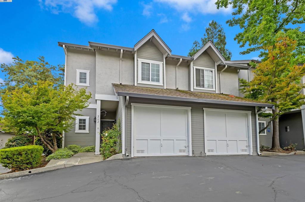 Beautifully renovated north-facing townhome on a quiet lane across from Kottinger Village Park and just a short walk to downtown Pleasanton’s charming shops and restaurants. Step inside to find White Oak laminate flooring throughout, accented by newer 4-inch baseboards and soft neutral paint. The updated quartz kitchen features stainless steel appliances including a gas range, refrigerator, and built-in microwave. A cozy family room showcases soaring vaulted ceilings, a skylight that fills the space with natural light, and a custom gas fireplace with mantle. The adjacent dining area opens to a private patio through new Andersen French doors, creating seamless indoor-outdoor living. Upstairs, two spacious bedrooms each feature renovated quartz bathrooms. The primary suite offers a walk-in closet, while the second bedroom enjoys a private balcony retreat. A convenient upstairs laundry closet includes a high-efficiency washer and dryer. Additional highlights include dual-pane windows with plantation shutters, a new roof scheduled for November, newer HVAC, deck, and fencing, ensuring comfort and peace of mind. This turnkey home blends modern updates with an unbeatable location—a rare find that won’t last long!