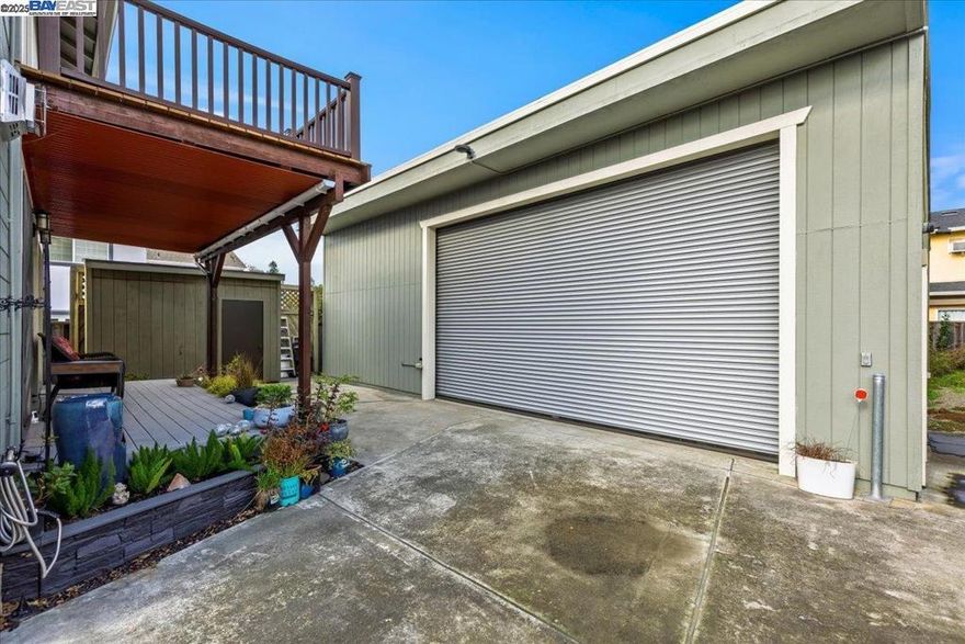 A Hidden Car-Collector's Jewel awaits! An elegantly expanded 1920's Craftsman complete Remodel with 40x40 10-Car Shop/Garage, gated paved driveway sideyard with concrete basement. Modern comfort meets preserved vintage charm from top balcony to basement floor! Greeted with a covered brick porch view, enter the Formal Living room with fireplace, hardwood floors that overflow into a versatile bedroom/den with full closet & rich wood French sliding doors. The oversize Kitchen remodel & dining area features large tile flooring, bright windows, large SS slab island, SS appliances, gas range w/ hood ventilation & large granite slab with custom cabinetry and storage. Tip toe up to the Primary Suite with gas fireplace, balcony & luxurious bath or tip toe down to the Family Room level with spacious bedroom & remodeled Bath 2. Wood french doors lead through the covered porch & open up to the 40x40 appx fully loaded open span shop/garage equipped with 20x11' commercial grade metal roll up door, finished walls with appx 14' height, 220-V, air compressor w/ airline hookups & more! Equipped with tankless WH & DP windows & doors.  The versatile layout maximizes your investment for work-home life to multi-general living & more. Centrally located near Hwy 580,  Castro Valley & Hayward amenities.