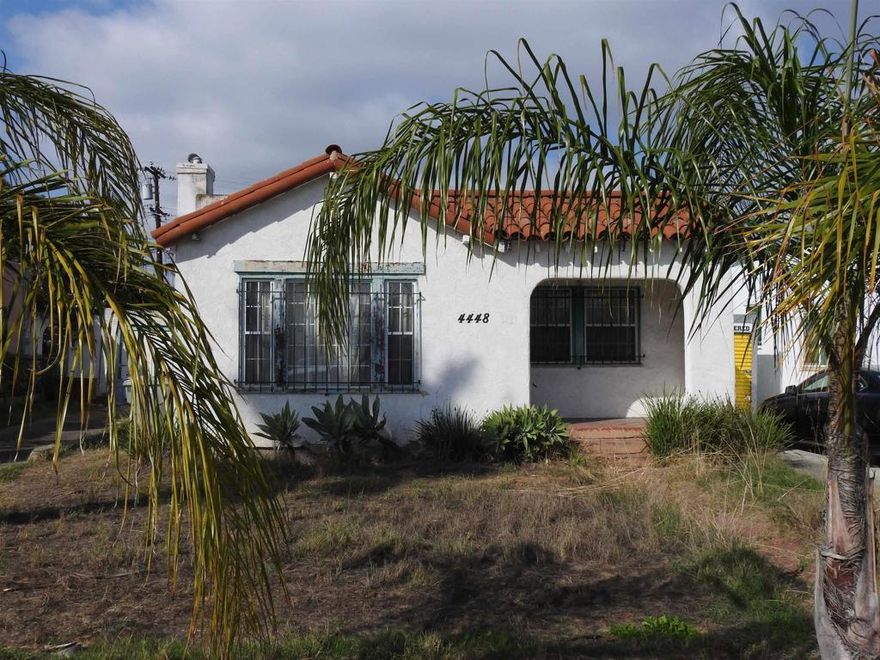 Normal Heights early century Spanish style 1,312 square feet cottage with great quite location, detached garage and large back yard. Nestled in between the 15 and 805 freeways and Adams Ave. and El Cajon Blvd, in a desirable walkable neighborhood. This cozy bungalow built in 1932 offers a covered porch to living room with original 1930’s front door, to living room with coved beam ceilings and fireplace with many original light fixtures. Archway to dining room which leads to hallway with one bath with classic tiled tub. Two bedrooms - King Bed fits nicely in the primary bedroom while the second bedroom opens to a walk through third bonus room with built in bookcases and access door to backyard. The home is set on a Set on a generous 6,235 sq./ft. RS-1-7 lot with expansive backyard that is perfect for hosting gatherings with family and friends or future expansion or ADU. Detached one car garage with plenty of extra driveway off street tandem parking for cars, RV, etc. Major fixer that offers incredible potential for investors or buyers ready to renovate. Will make a great project for someone that wants to preserve a historic home.