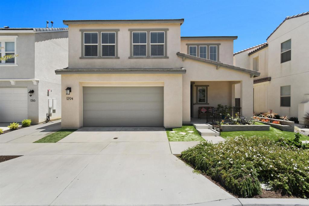 Welcome to this beautifully maintained home located in the desirable Village of Escaya! With 4 bedrooms, 3 bathrooms, and thoughtfully designed indoor - outdoor living spaces, this home is perfect for any family. A standout feature is the full bedroom and bathroom located on the main floor, perfect for guests or home office. Upstairs, you’ll find the remaining bedrooms, including the primary suite with an en-suite bathroom, dual vanities, and a walk-in closet. The upstairs laundry room adds extra convenience. Inside you’re greeted by a bright, open-concept floor plan that connects the living area to the kitchen—ideal for everyday living and entertaining. The kitchen boasts spacious countertops, SS appliances, plenty of cabinetry, and a spacious island. Step outside to enjoy sunny afternoons and warm summer nights in the beautifully designed backyard. The front and backyard are fully landscaped with low-maintenance turf. Fire up the grill, entertain guests, or simply relax under the Alumawood patio cover that offers shade and comfort. Additional highlights include: solar panels for energy efficiency, a mix of luxury vinyl plank and Berber carpet flooring, water softening system for the entire house, central A/C, and an attached two-car garage. Living in Escaya means access to amenities including parks, playgrounds, pools, spa, dog parks, a restaurant, and more. You're just minutes from Otay Ranch Mall, major retailers, and dining.