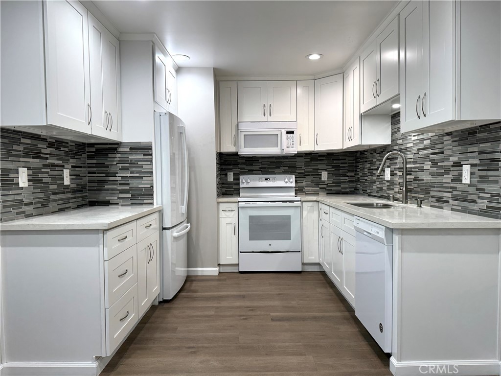 Ever dreamt you could live beach side? Now you can! Talk about location! This one bedroom, one bath renovated condominium is ready for you to move right in. Tucked into the back corner of the building, this condo features laminate flooring throughout, recessed lighting throughout, a modern kitchen, newer windows to maximize efficiency and limit exterior noise, and plenty of cabinet space. The attached balcony can be accessed through the large sliding glass doors from the living room. Windows in the dining room and bedroom also give you an enjoyable view of the balcony. This unit comes with one parking spot and a storage cabinet. Additional parking is available on the street or a permit can be purchased from the city to park in the beach parking lot year round. The building features 4 shared BBQ areas, a community room, 6 laundry rooms, a sauna, two fire pits, assigned bike rooms, rentable storage lockers if you need additional storage space, 2 elevators, and 5 shared guest parking spaces. The front of the building faces the beach and is within steps of the bike path, the pier, the beach, and local restaurants. Did I mention the Belmont Veterans Pier located right in front of the building will host events for the 2028 Olympics? This unit is such an amazing opportunity to enjoy beach living and will not last!