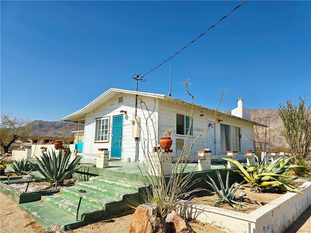 This property offers a truly unique opportunity to live immersed INSIDE the natural beauty and serenity of Joshua Tree National Park. With its expansive 10-acre landscape, complete privacy, and proximity to outdoor activities like hiking and rock climbing, it’s perfect for those seeking a retreat or a personal sanctuary. The three structures—main home, garage, and work shed—provide a flexible foundation for renovation and customization to realize your vision. The house has 2 bedrooms and 2 baths. The detached double garage and carport will keep the cars cooler. All structures can use some updating. Being just two miles from the North Entrance Station, you’ll enjoy convenient access while maintaining seclusion. Whether you’re an outdoor enthusiast, an artist, or someone looking to escape the hustle, this property invites you to craft your ideal desert sanctuary amid one of California’s most iconic landscapes. LOCATION, LOCATION, LOCATION!!!