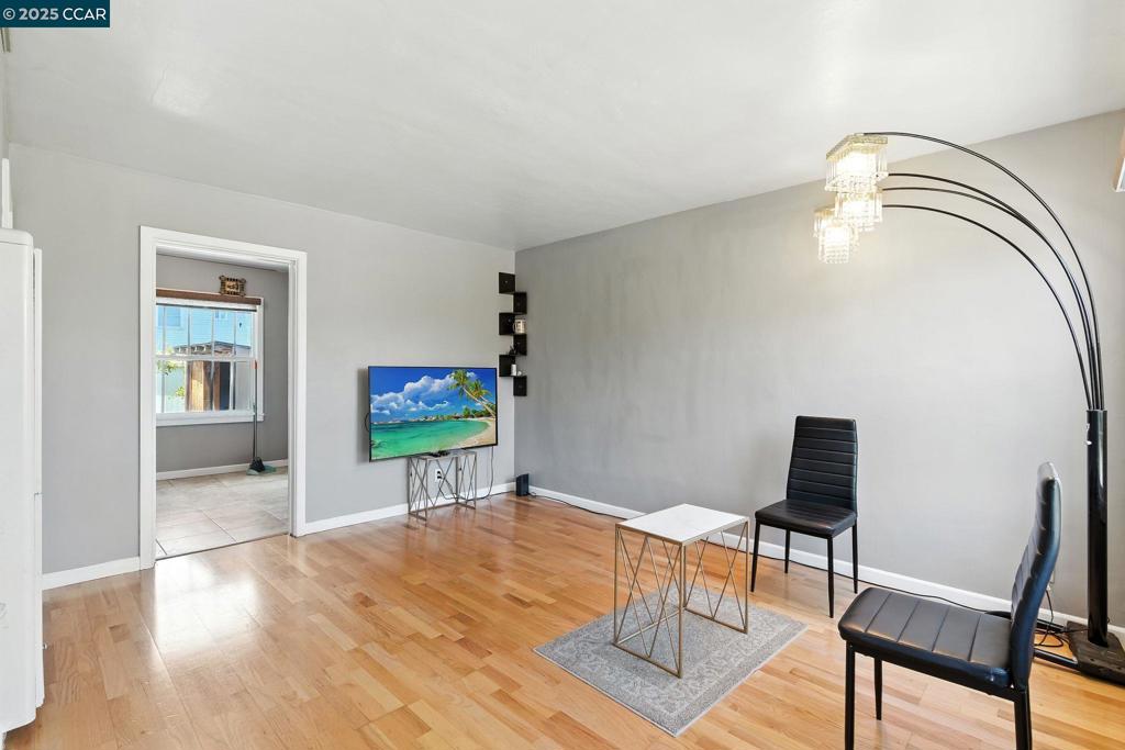 Located in Richmond’s historic Atchison Village, this two-bedroom, one-bath home offers 781 square feet of well-designed living space with a thoughtful blend of original charm and modern updates. Durable laminate flooring runs throughout the main living area downstairs as well as the upstairs hallway and bedrooms, while the kitchen and bathroom feature tile flooring for added durability. The kitchen includes updated cabinetry, stainless steel appliances, and a cozy eat-in dining area. The full bathroom has been tastefully renovated with permits and offers a clean, modern look. Additional highlights include dual pane windows, fresh interior paint, and a private backyard with a storage shed and dedicated laundry area. There is one assigned parking space for this unit. With classic architectural character and practical upgrades throughout, this home presents a unique opportunity in one of Richmond’s most established and historic neighborhoods.