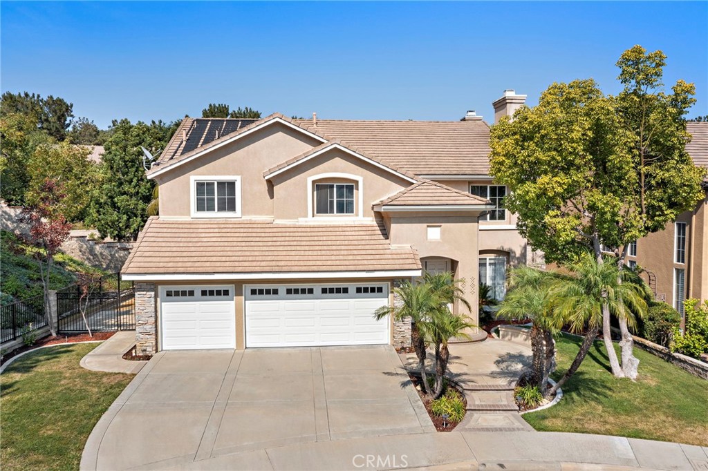 Nestled within the exclusive gated community of Canyon Crest in Mission Viejo, this impeccably maintained 5-bedroom, 3.5-bathroom estate offers luxurious living at its finest. Boasting 10-foot ceilings that enhance its spacious elegance, the home features a grand living room anchored by a large, custom-crafted fireplace, while the gourmet kitchen is equipped with brand-new Samsung appliances (less than one year old) and premium finishes. The thoughtful layout includes a convenient first-floor bedroom suite with private bathroom and a versatile upstairs loft. Outside, your private resort-style oasis awaits—complete with a sparkling pool, soothing spa, built-in BBQ for alfresco dining, and a cozy firepit for evening gatherings—all set within beautifully landscaped grounds on one of the largest lots in the community. Positioned at the end of a private cul-de-sac with only one neighboring property, this rare homesite delivers unparalleled privacy. Residents enjoy exclusive access to Lake Mission Viejo for boating and recreation, along with the security and prestige of gated community living. Ideally located near top-rated schools, The Shops at Mission Viejo, and major freeways, this pristine property represents the pinnacle of Southern California living, where every detail—from its meticulous condition to its premium amenities—reflects excellence in one of Mission Viejo’s most coveted neighborhoods.