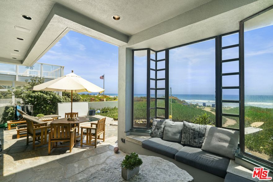 This spectacular one owner three level home is blessed with natural light and breathtaking views throughout and features high ceilings and skylights as well as bronze, copper, wood and high end finishings. This home is ideal for entertaining and seamless indoor/outdoor living. The ground floor includes a bedroom with a full bathroom, a chef's kitchen, a media room and a living room and dining area with ocean views flowing out to a large deck, spa, and partially sheltered "tea room". The media room, with adjacent bathroom/powder room, can easily serve as a bedroom. A custom stone fireplace graces the living room and dining area. The second floor includes two bedrooms, each with full bathrooms. The master suite includes a sitting room/ home office, a large closet that doubles as a "safe room" for security, custom stone fireplace and a generous deck that faces the ocean. The master bath includes a steam shower and spa tub. The home also has a basement which includes a walk-in custom wine cellar, computer-controlled HVAC and lighting systems, a laundry area, plenty of storage space as well as an additional refrigerator. A "dumb waiter" serves all three levels. The house has a state of the art ADT security system and privacy gates.  In addition, the house has a large detached guest quarters with a separate entrance. The guest quarters can easily be converted into two additional bedrooms. The home was recently measured by an independent appraiser who determined the total sq ft for the first and second floors, basement, garage and guest quarters to be 5,395. Public Records show Sq Ft to be 3,152. Buyer is advised to independently verify the accuracy of this information. The broker does not guarantee the accuracy of the information provided.