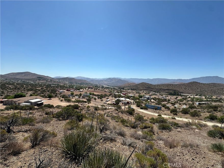 Discover nearly five acres of pristine California land, an ideal setting to design and build your dream home. Nestled amidst charming ranch-style residences, this serene parcel offers stunning, panoramic views of rolling hills that capture the essence of peaceful countryside living—yet it's conveniently located less than an hour's drive from the vibrant heart of downtown Los Angeles. Accessibility is a breeze, with the property just steps from the paved Sierra Highway, ensuring easy commutes and connections. Essential utilities are at your fingertips: electricity poles stand nearby for straightforward hookups, and a water well is already established on-site, simplifying your development plans. Plus, most building permits for a single-family home have already been submitted to the city, putting you ahead of the curve and ready to break ground. Whether you're envisioning a sprawling estate, a sustainable retreat, or a family haven, this versatile land provides the blank canvas you've been dreaming of

Opportunities like this are rare in such a desirable location—act quickly! PRICE IS NEGOTIABLE, AND SELLER FINANCING MAY BE AVAILABLE. Contact us today to learn more and make this property yours