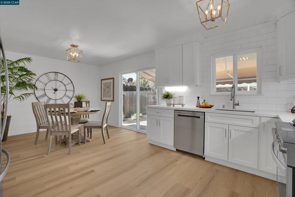 Completely remodeled beauty with designer touches inside and out! This charming single-family home offers 3 bedrooms, 2 full baths, and 1,103 sq. ft. of updated living space on a spacious 6,000 sq. ft. lot. Step inside to find brand-new LVP flooring, recessed lighting, double-pane windows, and fresh interior/exterior paint throughout. The kitchen shines with mid-to-high-end Whirlpool appliances, Calcatta Nouveau quartz counters (Granite Expo), and stylish finishes. The primary bath features Calcatta quartz on the vanity and in the walk-in shower—so luxurious! New HVAC, a new roof, and a new front door add peace of mind, while the beautifully landscaped yard boasts new sod, flowers, and an updated sprinkler system. The backyard is ready for entertaining with a pergola, motorized retractable awning, and a handy storage shed. Turn-key and truly move-in ready, this home blends comfort, function, and a touch of flair. Welcome home!