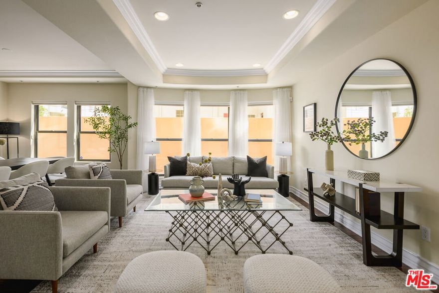 Located in a charming Tuscan-inspired building on one of Studio City's most sought-after tree-lined streets, this spacious single-level corner condo sits just steps from trendy restaurants, boutique shops, the Studio City Farmers Market, and all the vibrant conveniences of Ventura Boulevard. Featuring approximately 1,500 sq. ft. of living space, this unit offers an open floor plan with high ceilings, two bedrooms, 2.5 bathrooms, and two separate living areas, one complete with a cozy fireplace. The gourmet kitchen showcases granite countertops, premium stainless-steel appliances, and beautiful wood flooring that flows throughout the condo. The primary suite includes lush carpeting, a large walk-in closet, and a luxurious ensuite bathroom with a dual vanity, separate shower, and soaking tub. Additional highlights include in-unit laundry, a charming private patio, and convenient access to the building's amenities, which include gym, rec room, and beautifully manicured courtyard. The unit is located within a secure-access building and includes two parking spaces in a gated, covered garage, along with designated guest parking for visitors. Perfectly positioned for easy commuting, the building is just minutes from Laurel Canyon for quick access to West Hollywood and about five minutes to the 101 freeway, connecting you effortlessly with the entirety of LA.