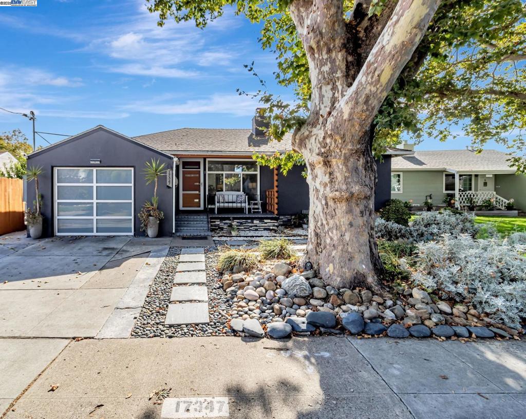 Nestled in a quiet cul-de-sac of San Lorenzo Village, this upgraded 3-bed, 1.5-bath home offers more than a place to live—it’s a lifestyle. Set on a rare oversized lot, it blends sustainability, comfort, and creativity in one inviting retreat. Step past matching front and garage doors into a private haven framed by new fencing and lush modular planters. Inside, spa-inspired bathrooms and sleek flooring offer modern elegance, while noise-canceling windows and sliding doors wrap you in peace. Eco-conscious living is built in: fully paid solar panels, Tesla Powerwall, EV chargers (inside & out), and upgraded electrical systems make Net Zero living a reality. Smart features like a Nest thermostat, dual-fuel furnace, heat pump, and updated plumbing bring ease to every day. Multiple backyard sheds spark imagination—perfect for a workshop, garden studio, or play space. With easy access to major freeways and a central location near shops, schools, and parks, convenience is always close to home. Welcome to your storybook beginning.
