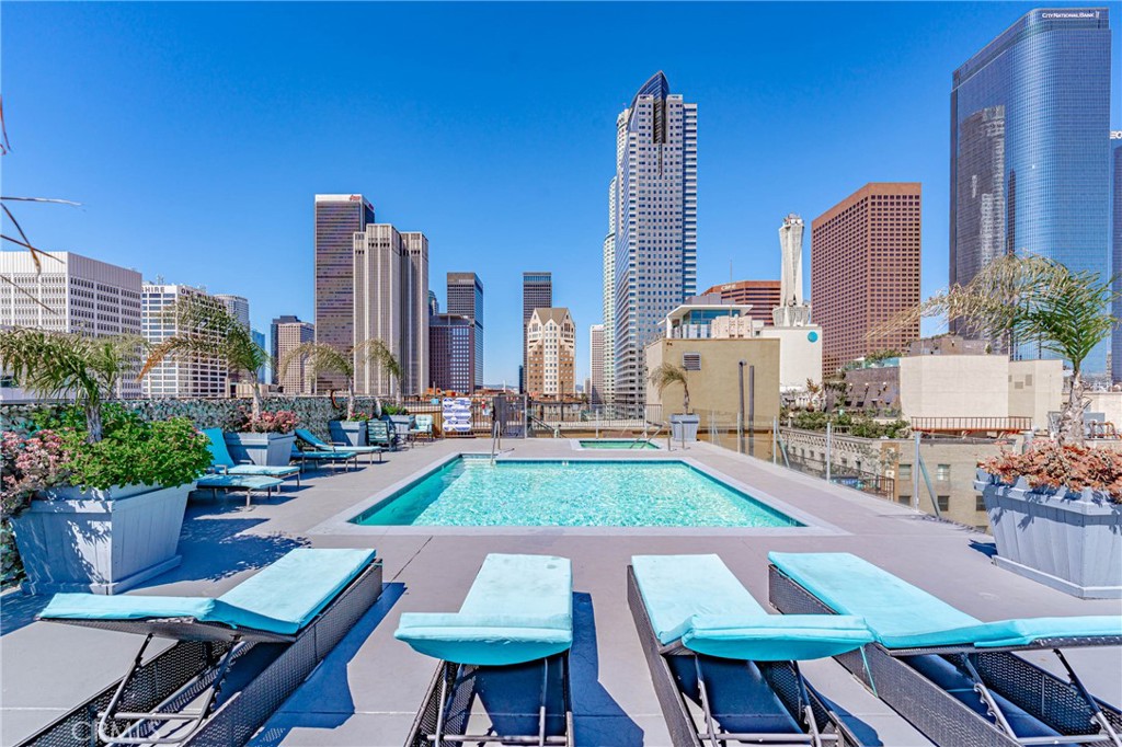 Welcome to the SB Grand Lofts at 312 West 5th St., #626, Los Angeles, CA! Nestled within the vibrant heart of Downtown LA’s Historic Core, this stunning loft-style condo offers a unique blend of historic charm and modern amenities. Originally built in 1923 by renowned architects Curlett & Bellman in the Beaux Arts style, this 12-story building was once a busting department store before its conversion into luxurious lofts in 2004. This unit presents a sleek and contemporary living space boasting 12-foot-high concrete ceilings & track lighting that creates an inviting ambiance. Large, oversized windows showcase breathtaking views of Pershing Square and the Downtown LA skyline flooding the space with natural light throughout the day. The galley kitchen features granite countertops, stainless steel appliances, & ample cabinet space. Laminate & hardwood floors add warmth & character to the interior. Additionally, the unit includes washer/dryer hookups for added convenience. Residents of the SB Grand Lofts enjoy access to a wealth of amenities including a rooftop pool, spa, & lounge offering 360-degree panoramic views of the bustling cityscape. For added peace of mind, the building provides 24/7 security guard services, front desk concierge, dry cleaning service, & a fitness room. Valet or self-parking options are available onsite for an additional monthly fee, ensuring hassle-free transportation. One of the standout features of this property is its flexibility – there are no pet restrictions, & Airbnb or short-term rentals are permitted, making it an ideal investment opportunity. Conveniently located at the corner of 5th and Broadway, residents are within a short distance from 5th St. Sunday Farmer’s Market, popular dining destinations such as Perch and Restaurant Row, as well as cultural landmarks like Grand Central Market and The Bloc. The proximity to Crypto Arena/LA Live ensures easy access to entertainment options. Don’t miss out on the chance to experience the best of Downtown LA living in this iconic building.
