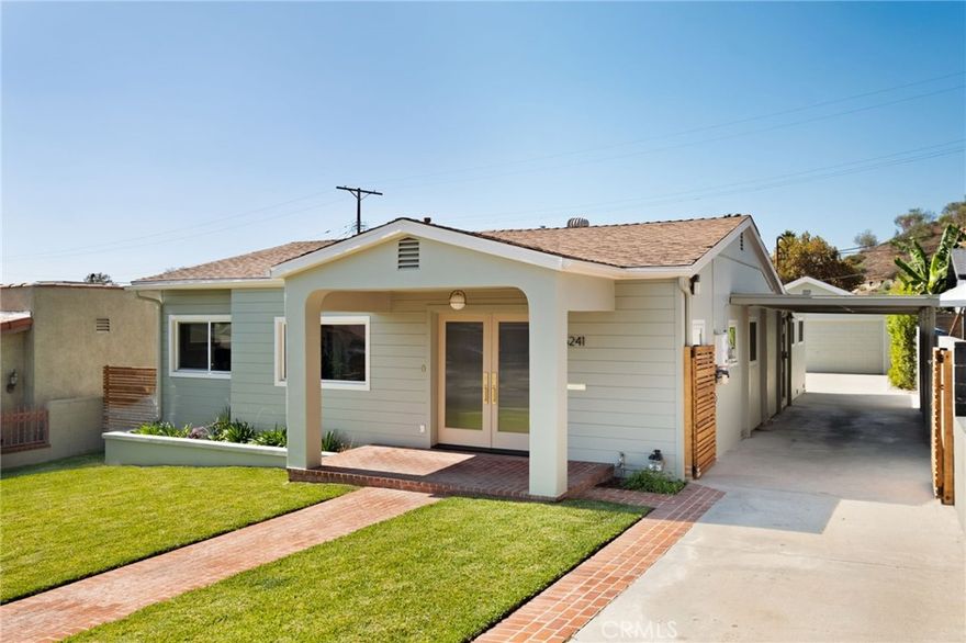 This romantic and dreamy Eagle Rock stunner awaits! Unparalleled craftsmanship, soft / warm natural light, joyful design moments and an easy breezy layout all blend seamlessly to bring you this 4 bed 2 bath (PLUS large family / flex room) charmer. Every detail has been intentionally and thoughtfully added to bring you a truly special and zen filled space. Updated systems, paid off solar panels and a long driveway w/ carport in ADDITION to a spacious 2 car garage and a fenced in yard are just a few of the perks that make this home so unique and appealing. Warm wood floors span the entirety of the bright interior. Just off the living area is a versatile bedroom or home office with wraparound windows and designer selected wallpaper. The gourmet kitchen is a showstopper with wood ceiling detail work, a dramatic center island with storage galore, under cabinet lighting, high end appliances, and seamless flow into both the living and family rooms. The oversized family room features a custom-built wet bar, beverage cooler, and direct access to the lush fenced in backyard! Down the hall, you'll find a generously sized bathroom adorned with designer tile, two bright and airy bedrooms, plus a breathtaking primary retreat. The backyard is a sanctuary and feels like your own private resort featuring lots of room for family play, dining al fresco or unwinding in the custom lounge around a brand new spa and built-in TV / entertainment area! All on a truly charming street with easy proximity to shops, restaurants and freeway without compromising a quiet / residential ambiance. The surrounding neighborhood is one Northeast LA’s most desirable pockets and exudes a small town energy while still offering the vibrance and accessibility to everything there is to love about the surrounding cities. Come live your best life in this Eagle Rock dream home!