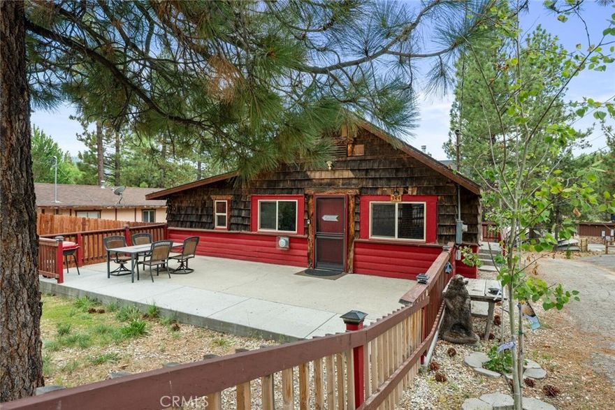 PRICE IMPROVMENT! Beautiful cabin in the Heart of Big Bear Lake! This charming cabin is ideally located close to the marina and the famous downtown Village! The living area features modern flooring that blends seamlessly with the classic cabin aesthetic, while insulated walls and windows ensure a comfortable ambiance throughout the year. Tasteful upgrades have been made to the home, maintaining the rustic allure you seek in a mountain getaway while enhancing its functionality and comfort. Outside, the property delights with its inviting deck that offers peek-a-boo views of the shimmering lake. Whether you're enjoying a morning coffee or a starlit dinner, the outdoor space is perfect for soaking in the natural beauty of Big Bear. The fully fenced backyard provides a private oasis for relaxation and gatherings, framed by a classic picket fence. Located just a stone's throw from Holloway's Marina, you'll enjoy instant access to the lake, making water activities a delightful part of your daily routine. Additionally, the cabin is conveniently close to the village, alpine magic slide, and Gilner Point, ensuring that adventure and amenities are never far away. As one of the best-priced homes in the area, this cabin is a rare find.