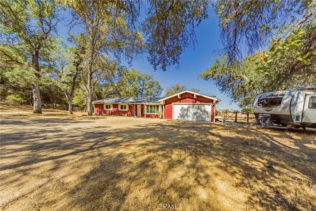 All of the Big Ticket items are done! NEW ROOF, NEW HVAC, NEW WINDOWS with plantation blinds, NEW FLOORING, UPDATED Kitchen and Bathrooms, and the exterior is freshly painted! Yes this spacious 3 bedroom 2 bathroom 1650 square foot home is move in ready and waiting for you to call it home! OWNED SOLAR to keep your utility bills low. HIGH SPEED FIBER OPTIC INTERNET. Beautiful sunset views from the back patio. RV parking, Fully equipped SHOP with A/C, Chicken Coop, Fenced area for pets, goat pen and a garden area all situated on 1.5 acres in the Foothills of the Sierra Nevada mountains. Close to Yosemite National Park, Bass Lake and an easy commute location to Hwy 41. 35 minutes to Fresno, but if you don’t want to go, INSTACART delivers to this location from many stores such as Costco, Target Walmart, etc.