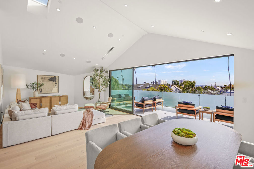 Experience the essence of modern coastal living in this striking new architectural residence, nestled in Santa Monica's highly sought-after Ocean Park neighborhood. Designed as a contemporary retreat, this tri-level home offers exceptional privacy and refined elegance, highlighted by sweeping ocean views from multiple expansive decks that blur the line between indoor and outdoor living. The sunlit open-concept kitchen and living area features custom finishes, bespoke cabinetry, and seamless flow, creating an inviting space for daily living and entertaining. The primary suite is a true sanctuary, offering a private deck, steam shower, outdoor spa, and generous walk-in closet, perfect for rest and relaxation. Each level is thoughtfully crafted to offer a distinct vantage point of the ocean and the vibrant community below. Located just moments from the sand, top-tier dining, boutique shopping, and picturesque parks, this home is a rare opportunity to embrace Santa Monica's effortless sophistication and coastal charm.