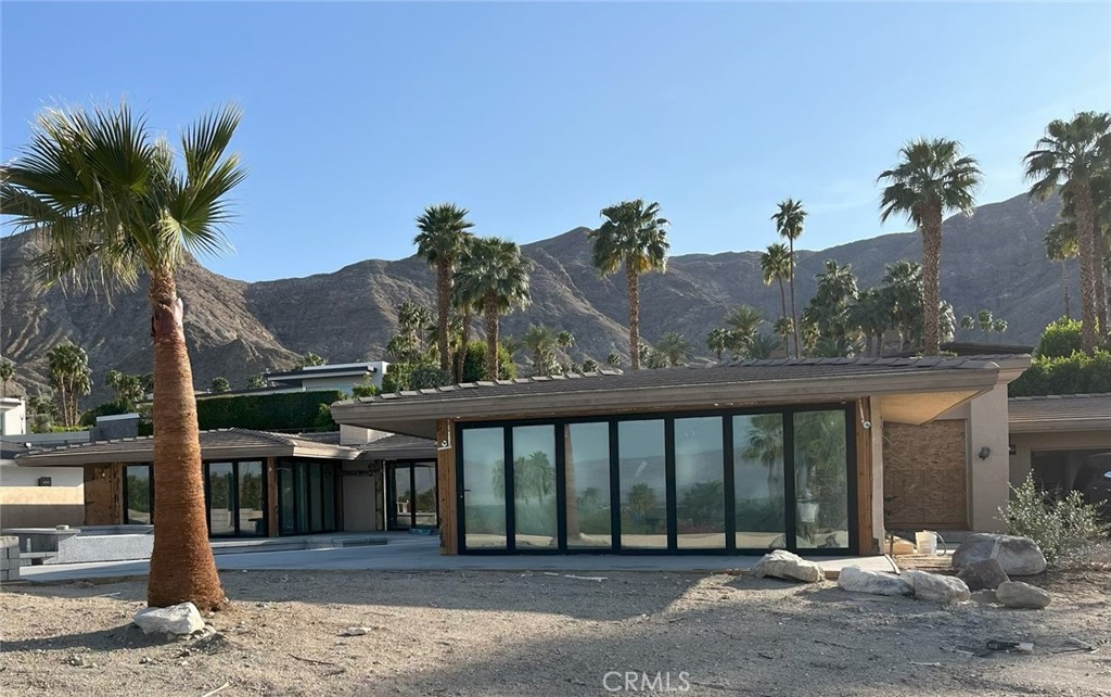 This project is just a few weeks from completion. More photos will be available once it is finished.
An iconic Thunderbird Heights estate perched above the Coachella Valley, this stunning single-level residence spans approximately 5,000 sq ft and sits on a generous half-acre lot. Built in 1958 and reimagined in 2025, the home artfully melds mid-century architectural charm with modern updates and enhancements.
The spacious great room features vaulted ceilings, a wet bar, and panoramic 180° valley and mountain views. Designed with an open floor plan for effortless entertaining and seamless California indoor-outdoor living, the home also includes a powder room conveniently located for guests.
70303 Calico Road is nearly complete and set to debut in 3 to 4 weeks—offering a rare opportunity to own a fully reimagined estate in the heart of Thunderbird Heights, one of Rancho Mirage’s most coveted gated communities. This 4-bedroom, 4.5-bathroom home (including an attached casita) has been completely remodeled from the ground up, with no surface or system left untouched.
Highlights include:
Machine-scraped hardwood floors throughout,
Designer-curated bathrooms blending modern elegance with timeless style,
All-new monumental windows and bi-folding doors creating expansive indoor-outdoor living spaces and
Fully automated pool and jacuzzi, controllable via smartphone.
From the great room’s soaring ceilings and sweeping mountain views to the tranquil poolside retreat, every element has been elevated for comfort, beauty, and ease of living.
Located just minutes from top-tier golf, dining, and resort amenities, this estate is a rare fusion of architectural heritage and state-of-the-art luxury—available for showings soon.