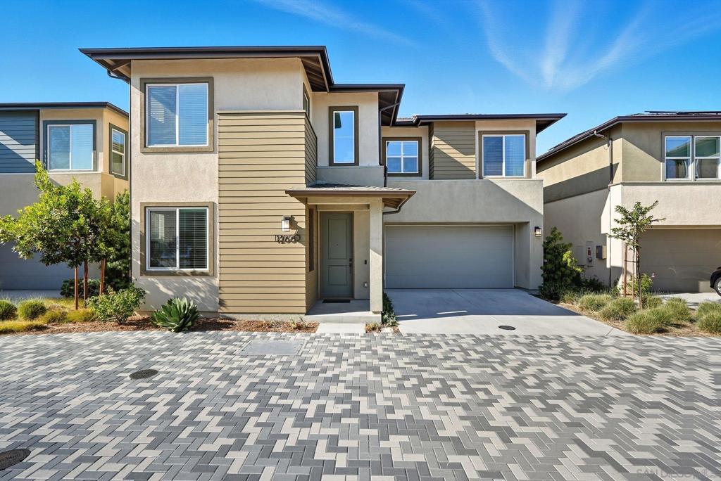 Built in 2022, this stunning 4-bedroom, 3-bathroom home in the highly sought-after Arlo community, offers 2,493 sq. ft. of modern living smart technology, and everyday comfort. Step inside to an open concept layout enhanced by Kent Oak luxury vinyl plank flooring throughout. A convenient downstairs bedroom offers flexibility for live-ins, in-laws, or overnight guests. The chef’s kitchen showcases stainless steel appliances, Biancone quartz countertops, and sleek smoke shaker cabinets. Everyday living is made simple with a WiFi enabled oven and dishwasher, washer and dryer, smart Rinnai tankless water heater, water softener, and Flo by Moen smart water monitor. Designed with luxury and efficiency in mind, it boasts OWNED solar, EV charging, and a full smart home system with WiFi-enabled appliances, Ring security with door and window sensors, Eero mesh WiFi, Ethernet wiring to every room, and programmable smart light switches. Custom touches add warmth and character, from the built in fireplace and TV wall in living room to the playroom cabinetry, a custom glass partition for aesthetics and safety, designer wood trim accent walls, and a backyard finished with turf and pavers for easy entertaining. Located within the top-tier Poway Unified School District, families will enjoy a variety of incredible schools for kids to attend. At Arlo, enjoy resort-style amenities including a pool, spa, BBQs, lounge areas, bathrooms, showers, and a playground, with front yard maintenance included. Just a short walk to new retail with pilates, coffee, a wine bar, and even a salon.