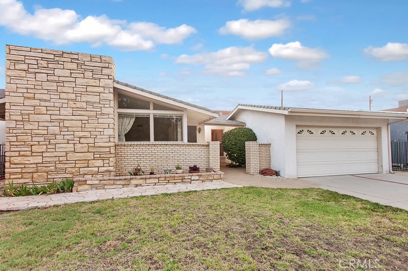 This great home is ideally situated on a peaceful CUL-DE SAC in one of Van Nuys’ most sought-after neighborhoods. Set on a 6,000 sq. ft. lot, the property boasts eye-catching curb appeal with its wrought iron fencing, expansive lawn, colorful raised stone planters, private patio framed by a manicured hedge, and a welcoming covered front porch. Here are just a few of its many exceptional features: Step inside to a freshly painted foyer with a large picture window, leading into a bright and open floor plan offering approximately 2,109 sq. ft. of living space. The sunlit living room features a beamed ceiling, abundant windows, a floor-to-ceiling raised hearth fireplace, and beautiful original hardwood floors. The home chef will love the well-equipped kitchen, complete with ceiling-height white cabinetry, generous counter space, a dual-basin sink, built-in oven, gas cooktop, dishwasher, and easy-care flooring. The oversized dining room, freshly painted and updated with new lighting, sits adjacent to the kitchen and offers an ideal space for everyday meals or formal gathering. The spacious family room—also freshly painted—features a large window, sliding glass doors to the backyard, dual mirrored closets, and new carpeting. A total of 3 bedrooms and 2 bathrooms. The primary bedroom includes a large picture window, double-door closet, new carpeting, and private access to the garage. Two additional light-filled bedrooms offer ample closet space and new carpeting. The main bathroom is bathed in natural light and features a freshly painted white dual-sink vanity, tile countertops, a large mirror with extra storage, and a jetted walk-in tub. The guest bathroom includes a freshly painted vanity, designer lighting, and a glass-enclosed tiled step-in shower. Hallway linen cabinets provide additional storage. Convenient indoor laundry closet. Central air and heat. The low-maintenance backyard offers privacy, relaxation, and entertaining potential, featuring a spacious covered patio and flower/garden beds. A gated driveway leads to the attached two-car garage with direct access, offering generous storage and off-street parking.