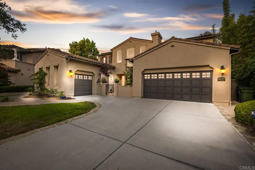 Nestled in the coveted Verrazzano neighborhood of sunny San Diego, this upscale residence is a study in thoughtful design and effortless entertaining on the largest lot in the community. A rare downstairs Primary Suite provides a private, spa-like retreat with direct access to outdoors, while an additional ensuite bedroom on the main level—ideal as a home office—opens through elegant French doors onto a gorgeous, light-filled courtyard. The main floor delivers exceptional flexibility with two separate living spaces, including a welcoming family room that flows into a spacious, well-appointed kitchen complete with Wolf stove, steam drawer, butler’s pantry, and generous walk-in pantry. There is an adjacent formal dining room built for memorable dinners and celebrations. Upstairs, discover two more bedrooms and baths (one ensuite) plus an oversized loft that unfolds through French doors onto a broad balcony—perfect for morning coffee or evening sunsets. Modern sustainability and convenience are built in with owned solar panels, a Tesla Powerwall battery system, and an EV charger. Step outside to an entertainer’s dream backyard: a custom fireplace sets the scene for cozy gatherings, a beautiful pergola invites al fresco dining, and thoughtful touches—an elevated play structure for kids and a productive garden for fresh produce—make this outdoor space as functional as it is picturesque. With impeccable indoor–outdoor flow, premium amenities, and rare large lot size in Verrazzano, this home offers a unique blend of luxury, practicality, and lifestyle. Schedule your private showing to experience it in person.