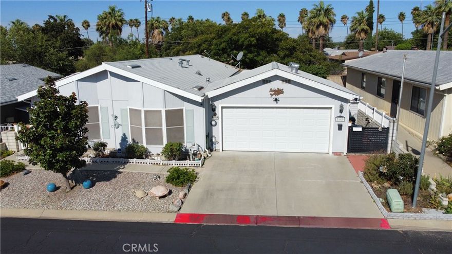 Beautifully updated 3 bedroom, 2 bath manufactured home located in the highly desirable 55+ Mountain Springs community. This spacious 1,440 sq. ft. home offers an open and inviting floorplan with a large living area, upgraded fireplace, and a bright kitchen perfect for everyday living and entertaining. A bonus enclosed patio room expands your living space and includes a relaxing hot tub — perfect for unwinding year-round.

The property features a fully fenced yard with fruit trees, ideal for gardening or simply enjoying the outdoors. A rare find in the park, this home also includes a 2-car detached garage and a large cement driveway, providing ample parking and storage.

Mountain Springs is a well-maintained senior community offering peaceful surroundings and convenient access to local amenities such as shopping, dining, entertainment and doctors. Enjoy the fresh air, scenic views and just a short drive to outlet stores and Palm springs. Don’t miss this beautifully cared-for home with upgrades throughout — move-in ready and waiting for its next owner.