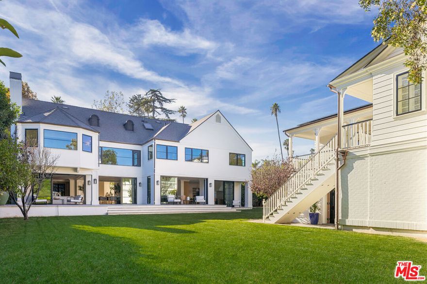 Introducing 414 South Cliffwood Avenue, an elegant estate set on over half an acre of impeccably manicured grounds in Brentwood. This impressive estate features a 6,890 square-foot main residence and a 2,800 square-foot guest house emphasize entertainment and connection in every part of the home. Originally built in 1987 and meticulously remodeled in 2024, this home exudes timeless elegance while being perfectly suited for modern living. The expansive property boasts seven bedrooms, including a luxurious primary suite with dual vanity bathroom and dual closets, a private study, and a serene meditation room. Four additional guest bedrooms are located in a separate wing. All with access to a children's library, ideal for family gatherings. Ideal for those who love to entertain, the estate features a chef's kitchen, a formal dining room, and a piano room, with a seamless flow to several outdoor lounge areas. The lush, landscaped gardens frame resort-style amenities, including a sparkling pool and cabana, sauna, multiple seating areas and a sport court. The guest house offers additional leisure, featuring a theater, billiard room and gym. This estate is the ultimate retreat, offering privacy, luxury and an abundance of amenities in one of LA's most sought-after neighborhoods. A short stroll to the Brentwood Country Mart, this is a rare opportunity to own a reimagined Brentwood estate.