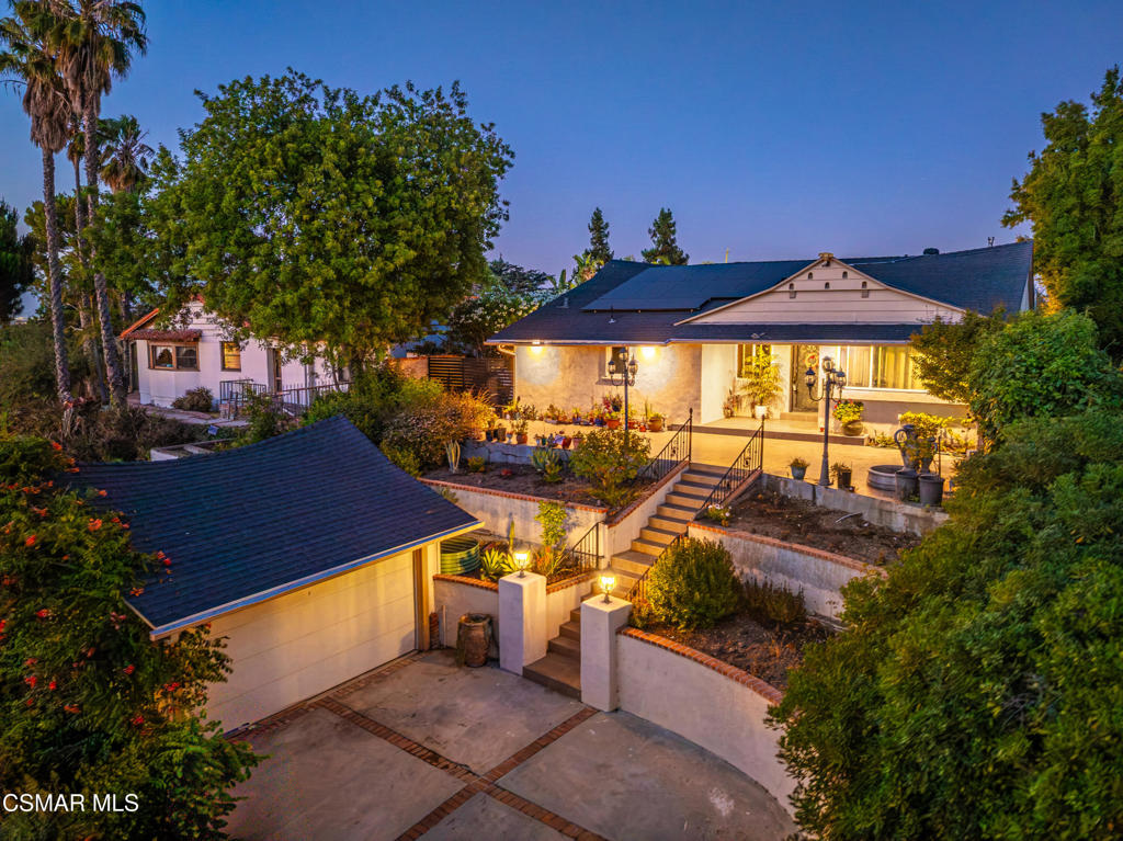 Location, Location, Location! Welcome to your hillside retreat in the heart of Sherman Oaks. This rare Mellentin-style home offers 3 bedrooms, 3 baths, and a sleek remodel blending modern comfort with scenic canyon views. The updated galley kitchen features contemporary finishes and efficient workspace. Step outside to a private pool surrounded by mature trees--perfect for relaxing or entertaining under the stars. Two detached structures offer extra flexibility: a 105 sq ft laundry/storage room and a 360 sq ft 2-car garage--ideal for creative use or potential ADU conversion. Close to Riverside Drive's shops and restaurants and minutes from Coldwater Canyon Park, this home delivers the best of both city living and peaceful nature. Bring your vision--opportunities like this are rare.