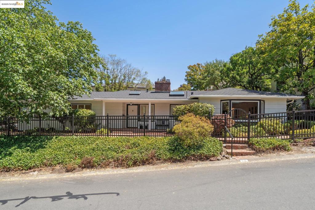 Welcome to 16 Muir Way, a tranquil, traditional one-level home w/ serene views of Tilden Park. Part of the Park Hills Homes Association, a neighborhood w/in the Berkeley Hills, east of Grizzly Peak, designed by Mason McDuffie. The neighborhood is comprised of 220 homes, built between 1939 & 1952. It offers several parks & walking paths, & features a beautiful entrance & fountain designed by architect, William Wurster. With Tilden Park, Lake Anza, Lawrence Hall of Science, Tilden Park Golf Course, The Botanical Gardens and public transit close by, this location is superb. The location coupled w/ the home’s practical 1 level floor plan, thoughtful separation of space & comfortable level out access to the yard, makes 16 Muir Way an exceptional property.T & J purchased this home 59 years ago, just 15 years after it was built. The views of Tilden Park from the primary br drew them to the house & they loved the majestic tree that graces the front yard, the proximity of the house to Tilden Park, & how quickly they could get to shops from this peaceful retreat. Features include 3-beds, 2 ba's, a great rm w/ fabulous storage, a remodeled kitchen, a spacious open liv rm/dining rm overlooking the backyard, a charming farmer's porch, a fully fenced yard & extensive upgrades throughout