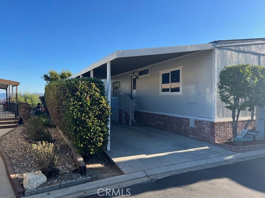 This home has amazing views.This 2 Bedroom and 2 Bathroom home has incredible views, that would be enough, but this home has so much more. Enjoy this Charming Manufactured Home, peaceful serenity overlooking the San Fernando Valley in West Hills, high above the noise with majestic views. Private, Gated Community, nestled up in the mountains in a very scenic setting, very tranquil and lovely. Breathtaking views from inside and outside the Home. This home has has been recently updated with new flooring through out, new kitchen with all new appliances and new updated bathrooms. This is a must see.